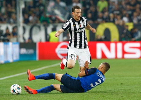 Juventus' Stephan Lichtsteiner foray forward is brought to a halt by the sliding Layvin Kurzawa.