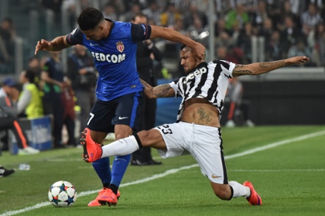Juventus’ Arturo Vidal displays an impressive horse tattoo as he attempts to tackle Nabil Dirar.