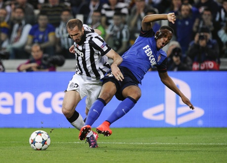 Monaco's Anthony Martial goes down under the challenge of Juventus' Giorgio Chiellini but the referee waves away the penalty appeals.