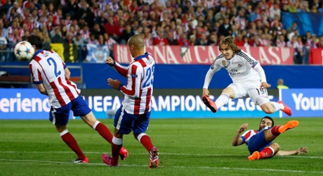 A flying Luka Modric goes close.