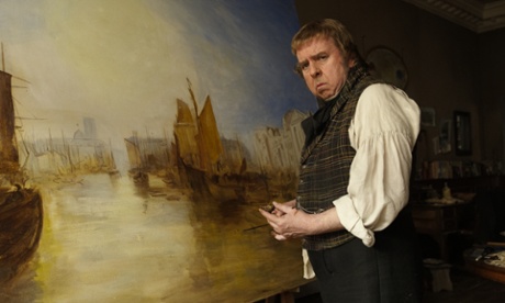 Spall in the title role of Mr Turner, standing in front of a painting