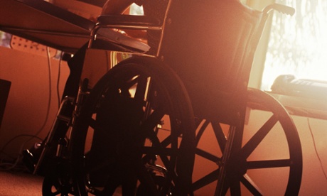 A disabled woman in a wheelchair using a computer