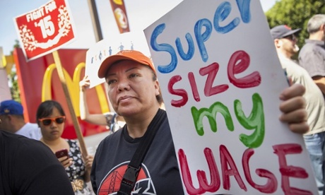 Protestors rally and close down a McDonald’s restaurant in downtown Oakland as hundreds of fast-food workers throughout the city join in on a worldwide campaign for higher pay and the right to form a union.