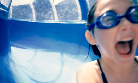 A girl on a water slide at a water park