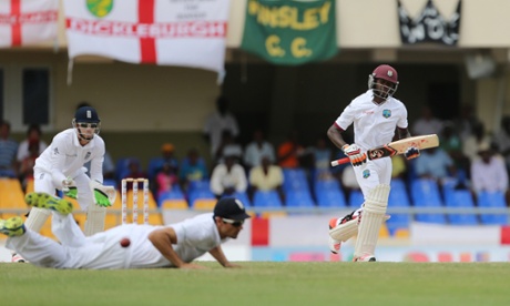 Jermaine Blackwood hits the ball past England's Alastair Cook to bring up his maiden test century.