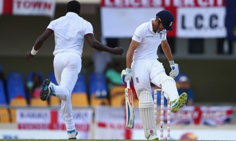 Alastair Cook of England kicks out in frustration after being dismissed for 13 runs caught by Sulieman Benn off the bowling of Jerome Taylor.