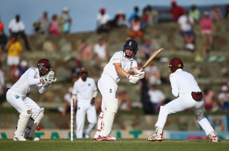 Gary Ballance plays to the legside as wicketkeeper Denesh Ramdin looks on.