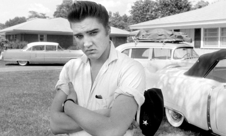 Elvis Presley is seen in the front yard of his home at 1034 Audubon Drive, Memphis, Tennessee in this handout photo from 1956
