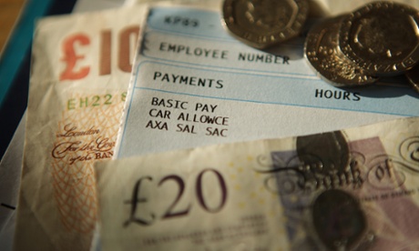 Pay slip surrounded by money. 