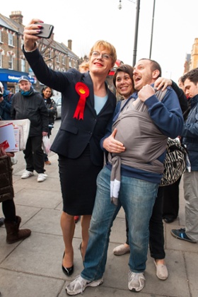 Eddie Izzard takes a selfie with a family on the campaign trail in Finchley, north London.