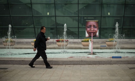 A man walks past a display outside the venue of the seventh World Water Forum in Daegu on April 13, 2011. Held every three years the World Water Forum aims to bring together political leaders, business people and activists to discuss water-related issues across16 themes, including climate change, natural disasters, and energy, and runs until April 17.