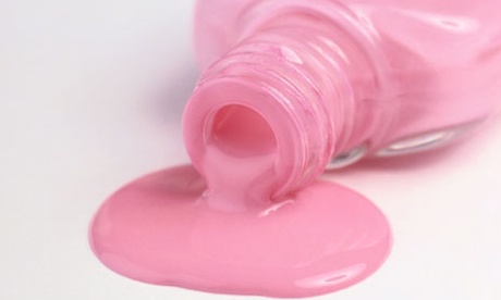 Pink nail varnish spilling from bottle