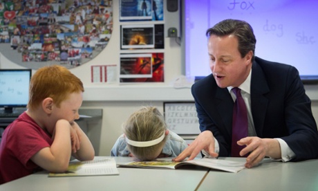 David Cameron with pupils at the Sacred Heart Roman Catholic Primary School in Westhoughton near Bolton.