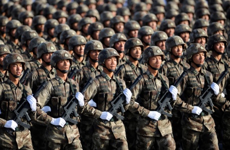 Soldiers from Chinese People's Liberation army march in formation during a training session.