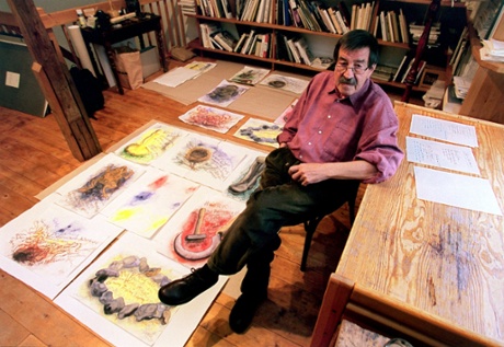Günter Grass with some of his drawings at his home in Behlendorf.