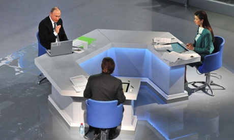 Putin gestures as he speaks during his annual televised phone-in.