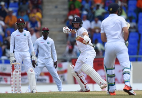 Gary Ballance celebrates after scoring his fourth Test century with a four off the bowling of Sulieman Benn.