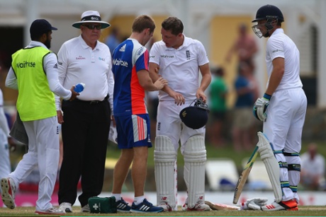 Gary Ballance is treated by physio Craig de Weymarn after being smacked on the arm from a powerful shot by Jos Buttler.