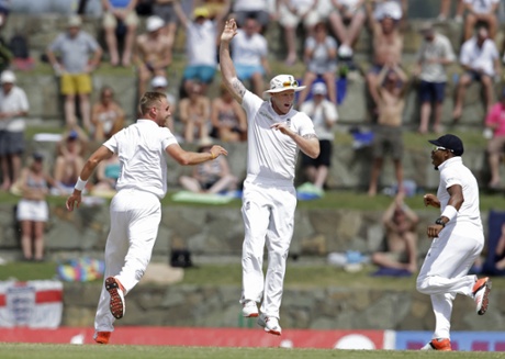 Broad, Ben Stokes and Chris Jordan celebrate the dismissal of Kraigg Brathwaite.
