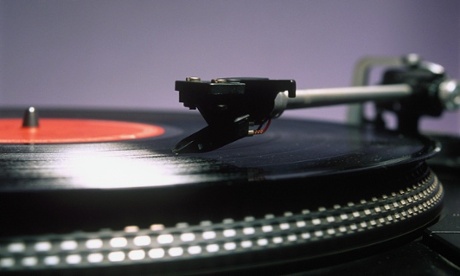 VINYL RECORD ON A TURNTABLE RECORD PLAYER DETAIL OF ARM LP LONG PLAY DECK MUSIC STYLUS