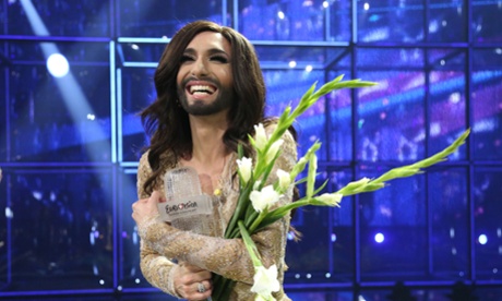 Conchita Wurst, seen here celebrating her 2014 Eurovision win, will be co-hosting this year's contest in Vienna.