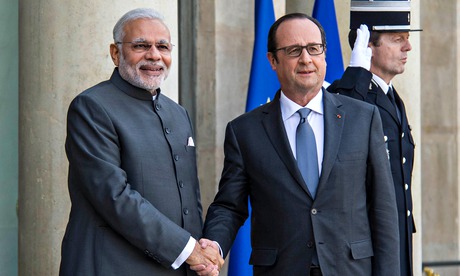 Francois Hollande shakes hands with Narendra Modi in Paris