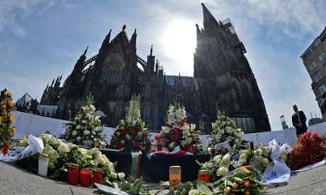 Flowers left by mourners outside Cologne cathedral.