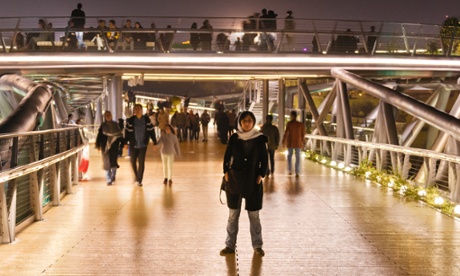 Iranian architect Leila Araghian standing on Tehran's Tabiat (nature) bridge, which she designed at 26.