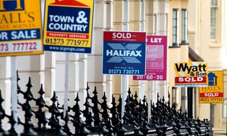 A street with for sale and to let signs outside houses
