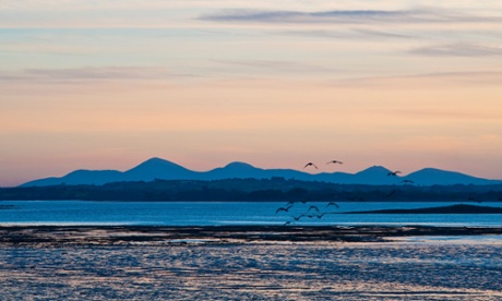 The view at sunset from Mount Stewart on the Ards Peninsula, over Strangford Lough to the Mourne Mountains.