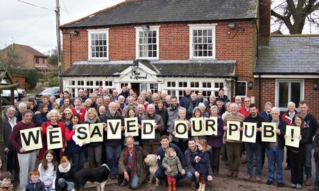 Locals celebrate the rescue of the Case is Altered in Bentley, Suffolk by their co-operative group i