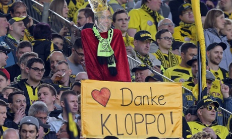 Borussia fans hold a banner reading 