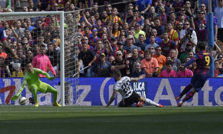 Luis Suarez puts Barcelona ahead against Valencia, his fourteenth goal in fifteen games.