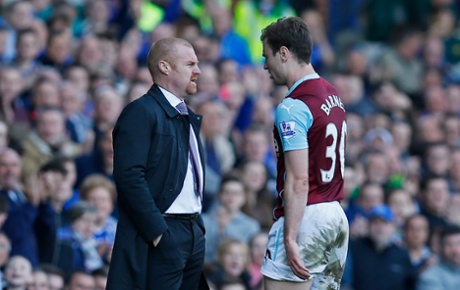 Ashley Barnes walks past manager Sean Dyche after seeing red for a second bookable offence when bringing Coleman down.
