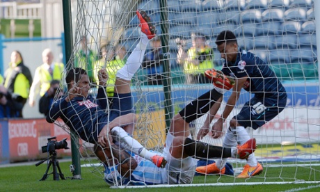 Tom Ince ends up in the net after scoring Derby's fourth.