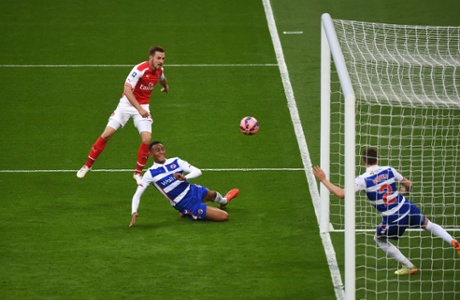Aaron Ramsey hits the post from close range.