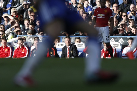 Louis van Gaal watches the action from the bench.
