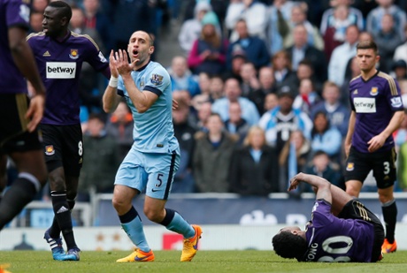Pablo Zabaleta reacts after fouling Alexandre Song.