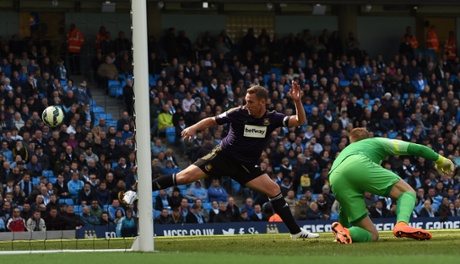 Kevin Nolan flashes at the ball but fails to guide it in.