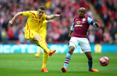 Jordan Henderson shoots under pressure from Fabian Delph.