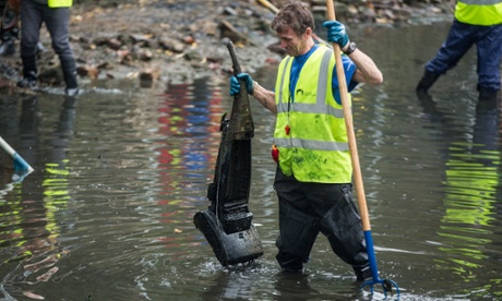 Volunteers clean up a stretch of Regent's canal near Salmon Lane lock, London.