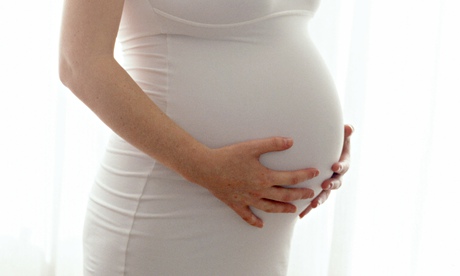 portrait of happy looking pregnant woman