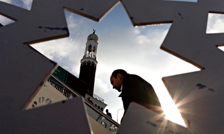 A man arrives for Friday prayers at the central Mosque in Birmingham