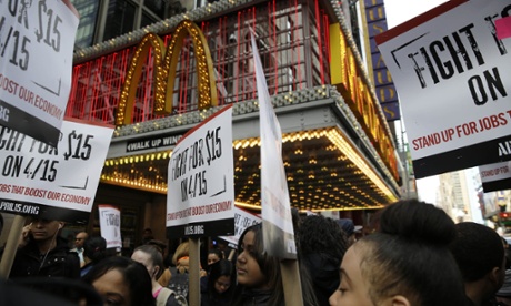 People participate in rally in front of a McDonalds in New York, Tuesday, March 31, 2015. Fast-food labor organizers say they're expanding the scope of their campaign for $15 an hour and unionization, this time with a day of actions including other low-wage workers and demonstrations on college campuses. (AP Photo/Seth Wenig)