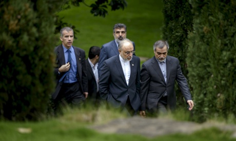 The head of the Iranian Atomic Energy Organisation, Ali Akbar Salehi (second right) talking with Hossein Fereydoon, special assistant to the Iranian president, in Lausanne.