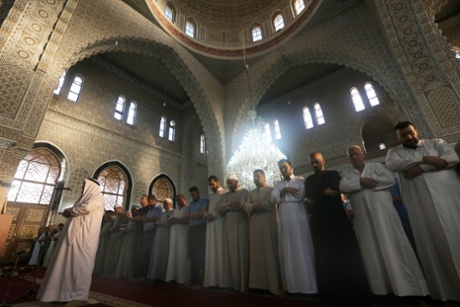 Iraqi Sunni Muslims perform prayers in the capital Baghdad.