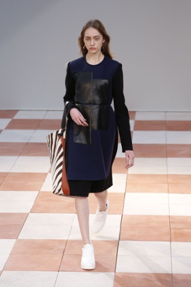 A model with a barely-there manicure walks at the Celine show. 