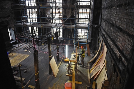 Builders at work in the Glasgow School of Art Mackintosh Library on February 11, 2015 in Glasgow, Scotland.