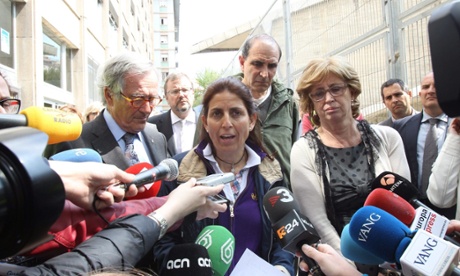 Instituto Joan Fuster's principal, Dolors Perramon (centre) speaks to reporters next to Barcelona's mayor, Xavier Trias (left), and Catalan regional education minister, Irene Rigau.