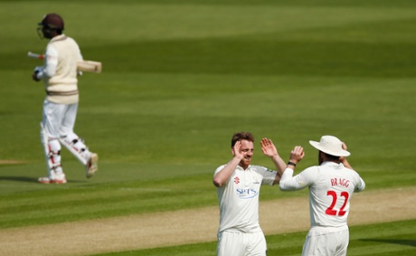 Glamorgan’s David Lloyd celebrates with William Bragg after taking the wicket of Surrey’s Kumar Sangakkara.